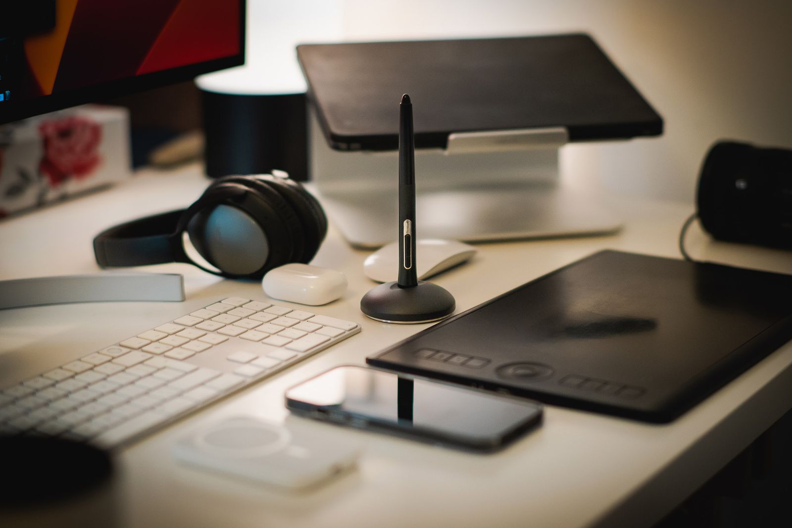 A designer desk with a drawing tablet