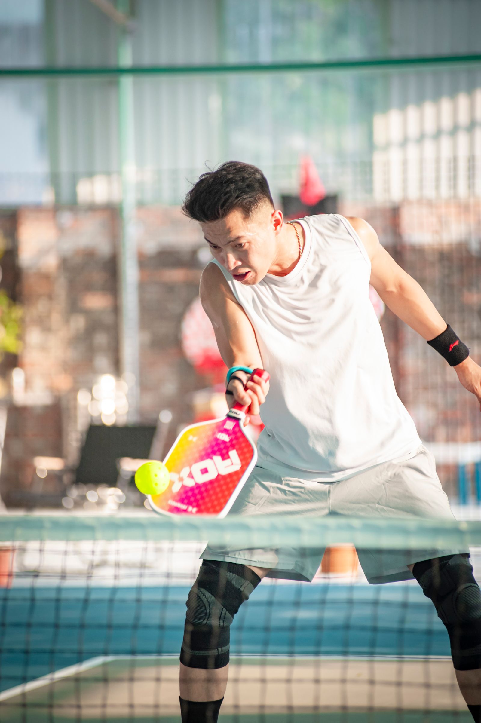 A player in action on a pickleball court